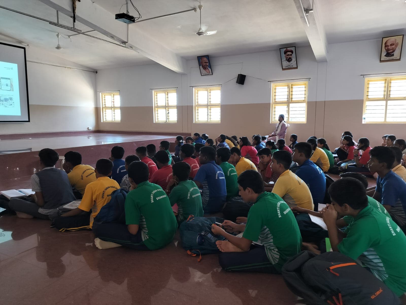 A SkillX facilitator presenting to a school assembly